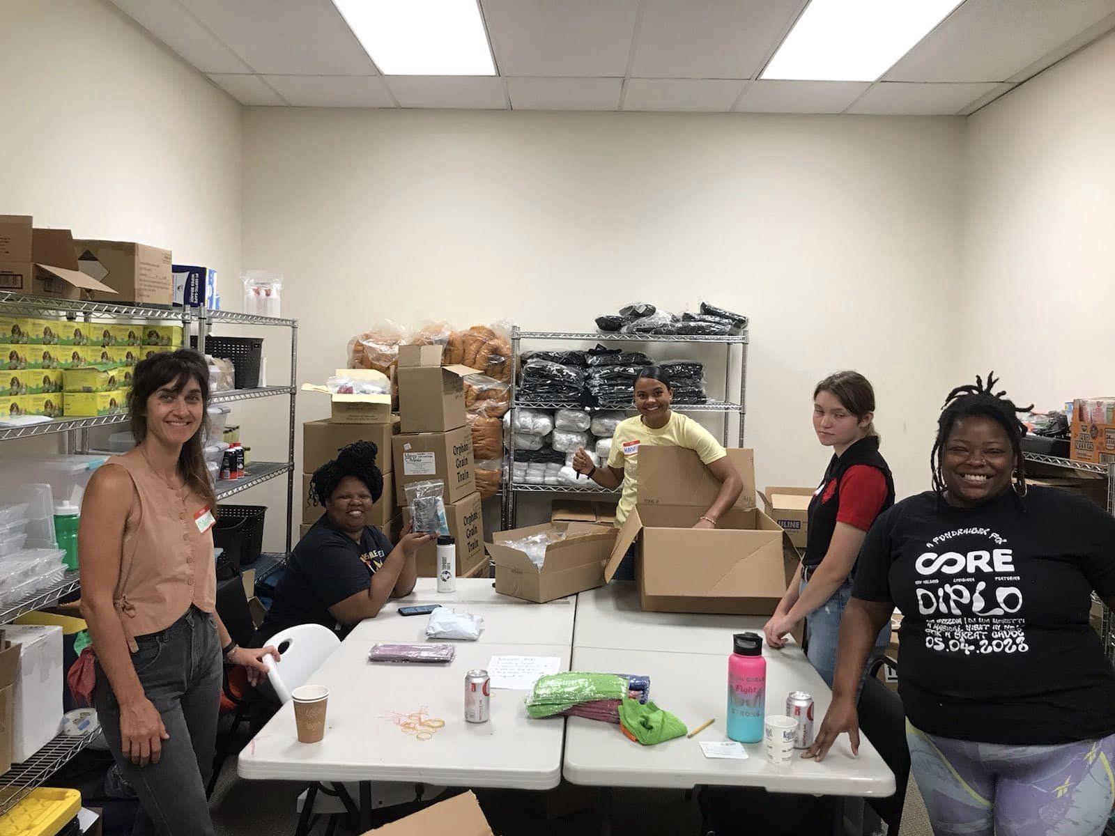 Image of beanstalk founders and volunteers preparing food and emergency kits