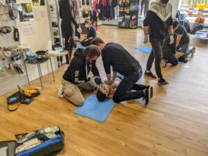 image shows people learning how to perform CPR during an emergency