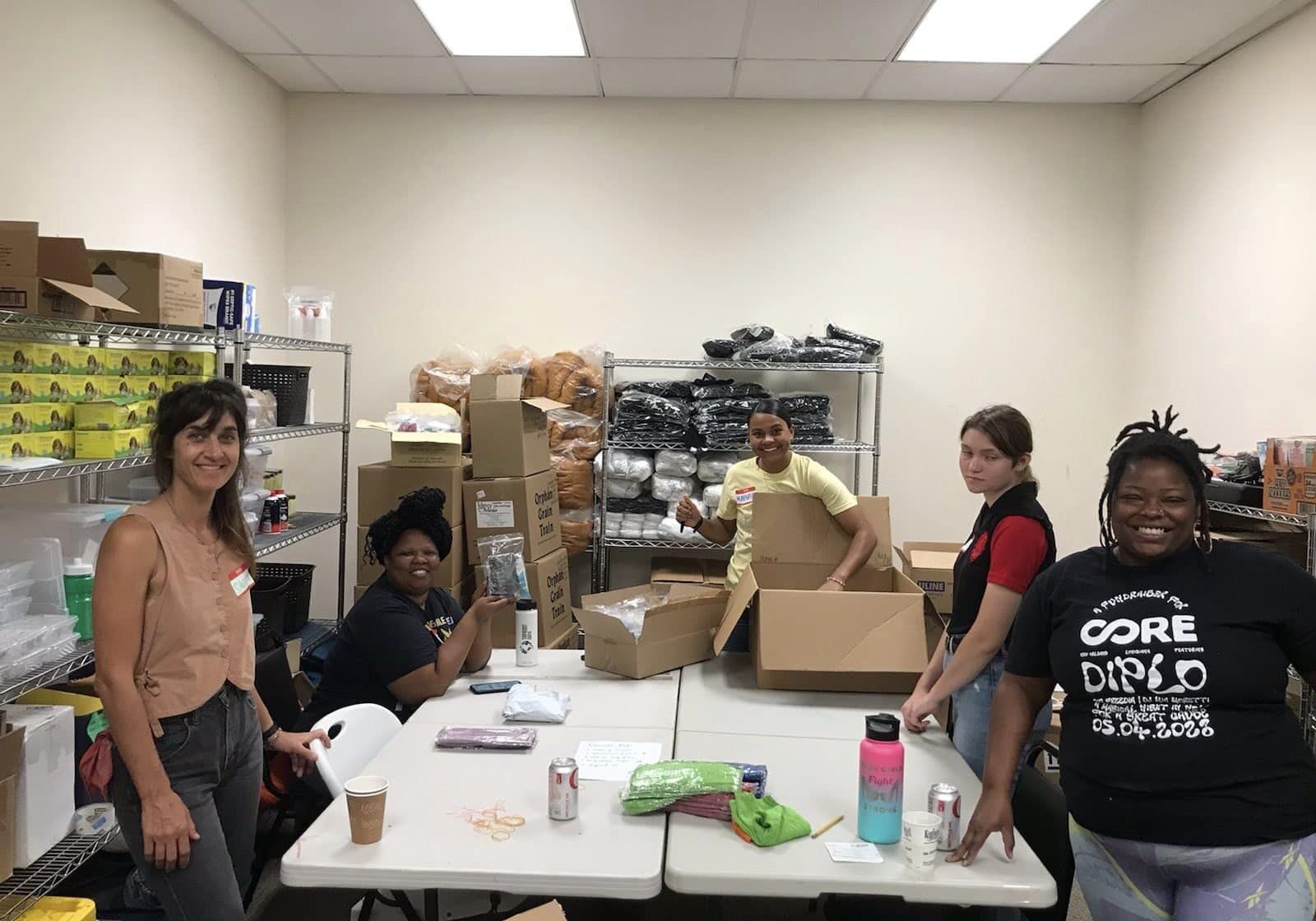 Image of beanstalk founders and volunteers preparing food and emergency kits